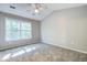 Spacious bedroom with vaulted ceiling, ceiling fan, and large window at 1201 Pine Bluff Dr, Summerville, SC 29483