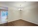 Elegant dining room with hardwood floors, chandelier, and view to outside living at 1201 Pine Bluff Dr, Summerville, SC 29483