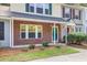 Attractive townhouse exterior featuring brick accents, manicured greenery, and a welcoming entrance at 1201 Pine Bluff Dr, Summerville, SC 29483
