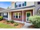 Charming townhouse featuring a brick facade, well-maintained landscaping, and inviting front entrance at 1201 Pine Bluff Dr, Summerville, SC 29483