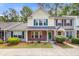Inviting two-story townhouse with colorful shutters, brick accents and manicured landscaping at 1201 Pine Bluff Dr, Summerville, SC 29483