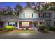 Inviting two-story townhouse with colorful shutters, brick accents and manicured landscaping at 1201 Pine Bluff Dr, Summerville, SC 29483