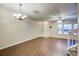 Bright living room features hardwood floors, neutral walls, and natural light from windows and a ceiling fan at 1201 Pine Bluff Dr, Summerville, SC 29483
