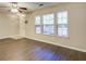 Bright and airy living room featuring dark wood floors and large windows for natural light at 1201 Pine Bluff Dr, Summerville, SC 29483
