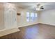 Open-concept living space with hardwood flooring, bright windows, and a white front door at 1201 Pine Bluff Dr, Summerville, SC 29483