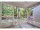 Screened porch with views of treed backyard at 1201 Pine Bluff Dr, Summerville, SC 29483