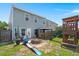 Well maintained backyard with patio, fire pit, playset, and gazebo for outdoor living and entertainment at 127 Longford Dr, Summerville, SC 29483
