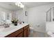 A bright bathroom featuring a large mirror above a double sink vanity for a luxurious experience at 127 Longford Dr, Summerville, SC 29483