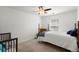 A bedroom featuring two beds and a chair bathed in soft light from the window at 127 Longford Dr, Summerville, SC 29483