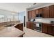 Bright kitchen showcasing stainless steel appliances, granite countertops, and neutral tile flooring at 127 Longford Dr, Summerville, SC 29483