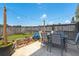Inviting backyard patio with string lights, dining area, and lush greenery creating a cozy outdoor space at 127 Longford Dr, Summerville, SC 29483