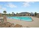 Community swimming pool with lounge chairs, umbrellas, and a nearby pavilion for a resort-like feel at 127 Longford Dr, Summerville, SC 29483