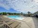 Large community swimming pool with lounge chairs and a playground, perfect for relaxation and fun at 127 Longford Dr, Summerville, SC 29483