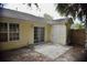 Charming back patio with sliding glass doors, concrete, and lush landscaping at 1341 Pinnacle Ln, Charleston, SC 29412