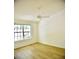 Sunny bedroom showcasing wood floors and a bright window for natural light at 1341 Pinnacle Ln, Charleston, SC 29412