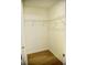 Open walk-in closet with light wood flooring and a metal shelf at 1341 Pinnacle Ln, Charleston, SC 29412