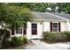 Inviting home exterior featuring a well-manicured lawn and charming architectural details at 1341 Pinnacle Ln, Charleston, SC 29412