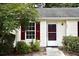 Charming home featuring red shutters and a well-maintained front yard with lush greenery at 1341 Pinnacle Ln, Charleston, SC 29412