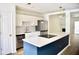 Modern kitchen featuring stainless steel appliances, white cabinets, and a stylish center island at 1341 Pinnacle Ln, Charleston, SC 29412