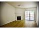 Inviting living room with light wood floors, a cozy fireplace, and sliding glass doors at 1341 Pinnacle Ln, Charleston, SC 29412