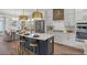 Modern kitchen with a center island, stainless steel appliances, and an adjacent dining area at 140 Falaise St, Charleston, SC 29492