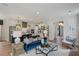 Bright and airy living room connected to an open kitchen, featuring hardwood floors and stylish decor at 140 Falaise St, Charleston, SC 29492