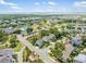Picturesque aerial view of the residential neighborhood featuring lush landscapes and a community pool at 1495 Keshi Pearl Dr, Mount Pleasant, SC 29466