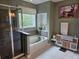 Relaxing bathroom featuring a soaking tub, walk-in shower, and modern decor at 1495 Keshi Pearl Dr, Mount Pleasant, SC 29466