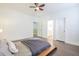 Bright bedroom featuring a bed with stylish linens and an open doorway to the bathroom at 1495 Keshi Pearl Dr, Mount Pleasant, SC 29466