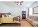 Bedroom featuring a bed, a sofa, dark wood floors and natural light from the windows at 1495 Keshi Pearl Dr, Mount Pleasant, SC 29466