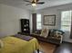 Comfortable bedroom with large windows, ceiling fan, and hardwood floors at 1495 Keshi Pearl Dr, Mount Pleasant, SC 29466