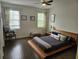 Cozy bedroom with hardwood floors, ceiling fan, and natural light at 1495 Keshi Pearl Dr, Mount Pleasant, SC 29466