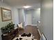 Hallway featuring beautiful artwork, white trim, and an abundance of natural light at 1495 Keshi Pearl Dr, Mount Pleasant, SC 29466