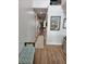 Inviting hallway with hardwood floors, recessed lighting, and stylish decor at 1495 Keshi Pearl Dr, Mount Pleasant, SC 29466