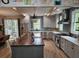 A gourmet kitchen features a large island, stainless steel appliances, and sleek cabinetry with stylish countertops at 1495 Keshi Pearl Dr, Mount Pleasant, SC 29466