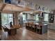 Spacious kitchen with a large island, stainless steel appliances, and a dining area with a wooden table at 1495 Keshi Pearl Dr, Mount Pleasant, SC 29466