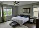 Serene main bedroom featuring a ceiling fan, natural light, and a plush area rug at 1495 Keshi Pearl Dr, Mount Pleasant, SC 29466