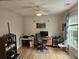 Bright home office featuring a ceiling fan, large windows, and natural light at 1495 Keshi Pearl Dr, Mount Pleasant, SC 29466