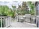 Outdoor kitchen area with stainless steel grill and a wooden table, perfect for backyard barbeques at 1495 Keshi Pearl Dr, Mount Pleasant, SC 29466