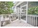 Outdoor grill with an eating area visible through the screen porch at 1495 Keshi Pearl Dr, Mount Pleasant, SC 29466