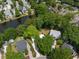 Aerial view of a charming neighborhood with tree-lined streets and a serene pond at 1514 Village Sq, Mount Pleasant, SC 29464