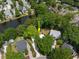 Aerial view of a charming neighborhood with tree-lined streets and a serene pond at 1514 Village Sq, Mount Pleasant, SC 29464