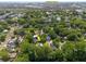 An aerial view of a residential neighborhood near Sullivans Island, surrounded by mature trees and a serene pond at 1514 Village Sq, Mount Pleasant, SC 29464