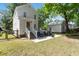 Beautiful backyard featuring a well-maintained lawn and inviting patio area with chairs at 1514 Village Sq, Mount Pleasant, SC 29464