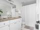 Bright bathroom vanity featuring granite countertops and white cabinets at 1514 Village Sq, Mount Pleasant, SC 29464