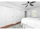 Bright bedroom featuring hardwood floors, ceiling fan, and closet with sliding doors at 1514 Village Sq, Mount Pleasant, SC 29464