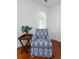 Bedroom corner with a blue patterned arm chair and side table at 1514 Village Sq, Mount Pleasant, SC 29464