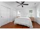 Bright bedroom with neutral decor, ceiling fan, and hardwood floors at 1514 Village Sq, Mount Pleasant, SC 29464