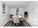 Dining space featuring a round table, four chairs, and a flatscreen television with a view to the exterior at 1514 Village Sq, Mount Pleasant, SC 29464