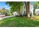 Charming two-story home with a well-maintained lawn, mature trees, and a detached garage at 1514 Village Sq, Mount Pleasant, SC 29464